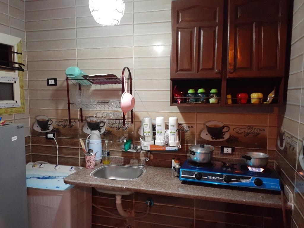 A kitchen or kitchenette at Free Wi-Fi شقة فندقية فى الاسكندرية New apartment sea view Alexandria
