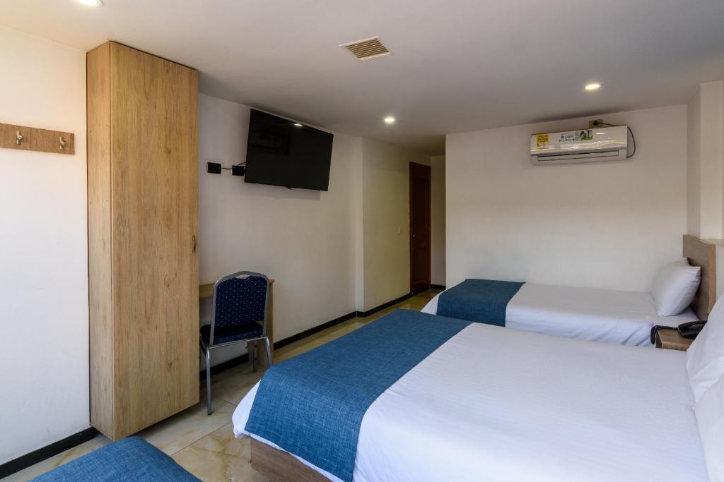 Postel nebo postele na pokoji v ubytování Hotel Med Estadio