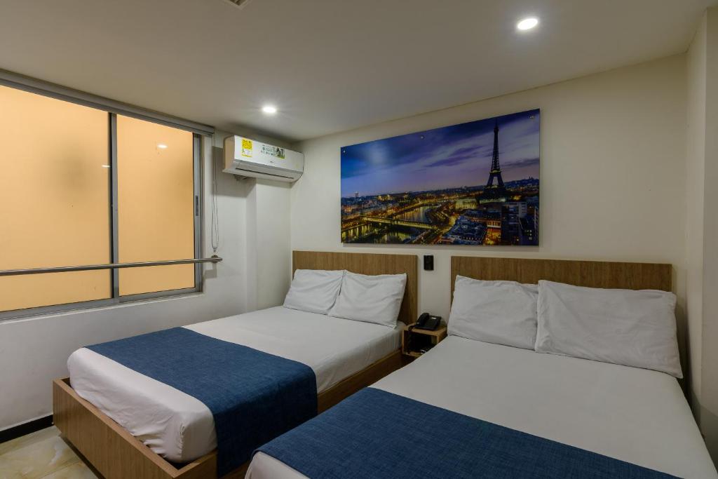 Postel nebo postele na pokoji v ubytování Hotel Med Estadio