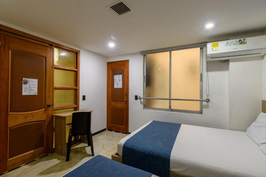 Postel nebo postele na pokoji v ubytování Hotel Med Estadio