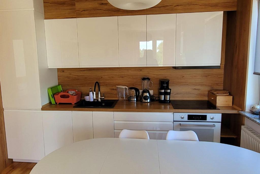 Kuchyňa alebo kuchynka v ubytovaní Apartament Comfort Del Mar IV Kolobrzeg