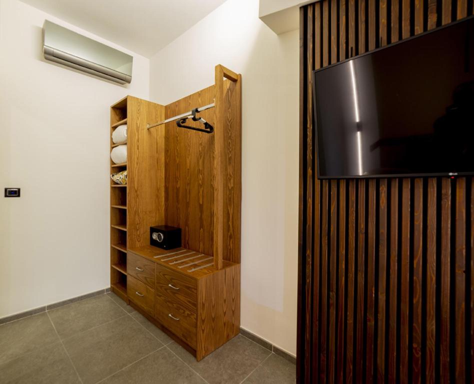 Televízia a/alebo spoločenská miestnosť v ubytovaní Balneum Rooms & SPA