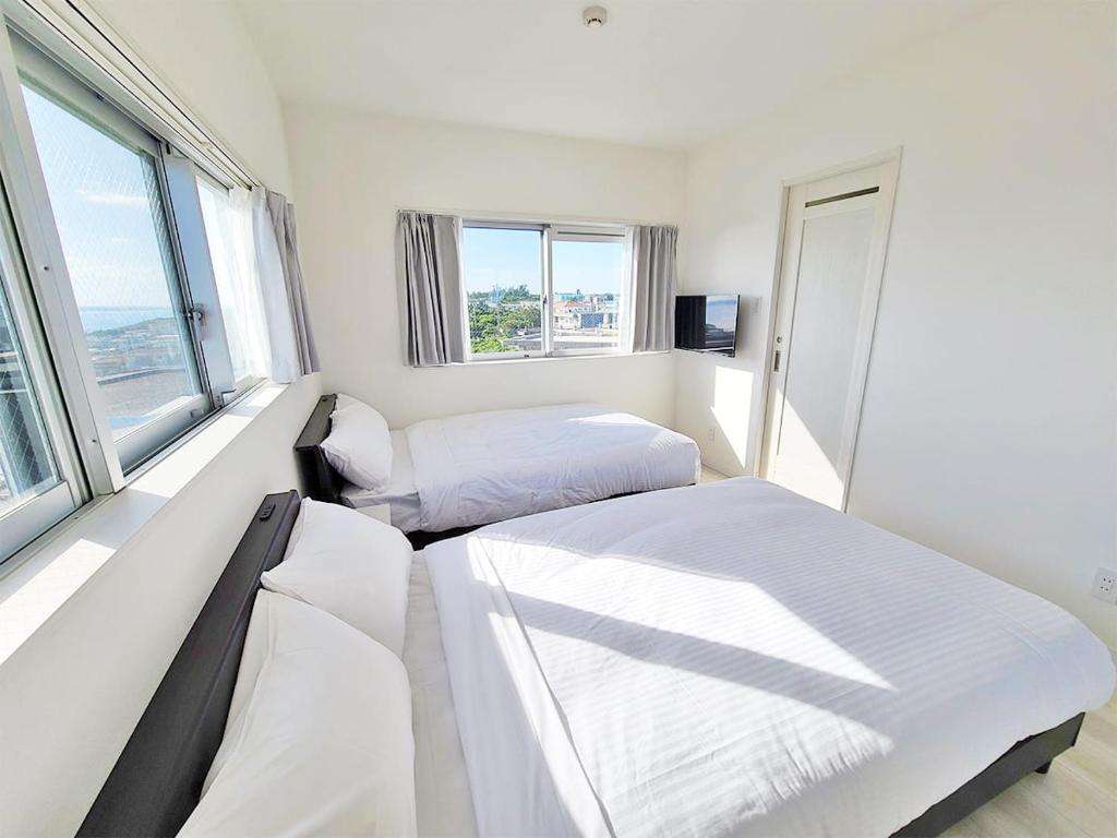 Postel nebo postele na pokoji v ubytování HOTEL Kuu
