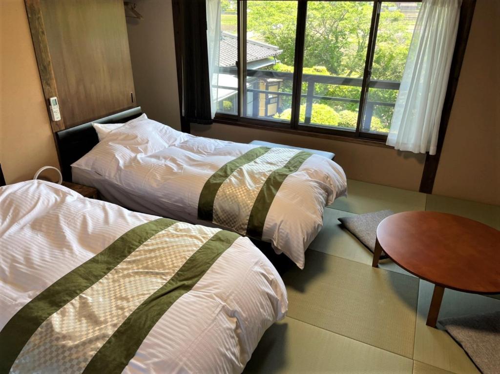 Letto o letti in una camera di Sanso Tanaka
