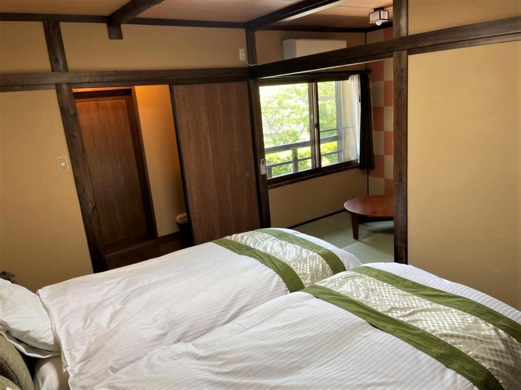 Letto o letti in una camera di Sanso Tanaka