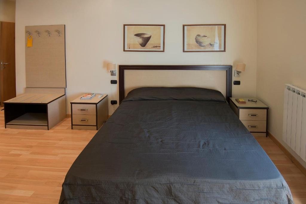 A bed or beds in a room at My Rooms