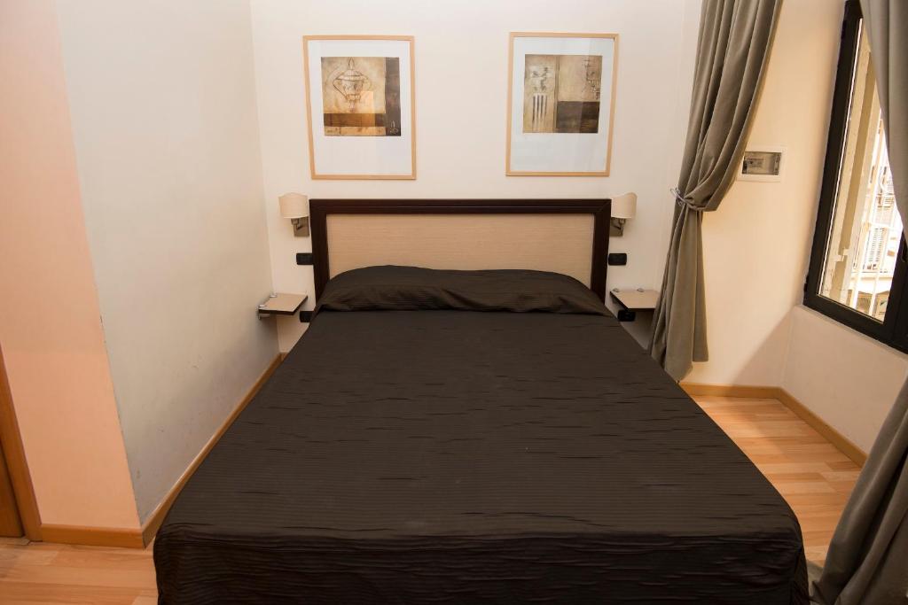 A bed or beds in a room at My Rooms