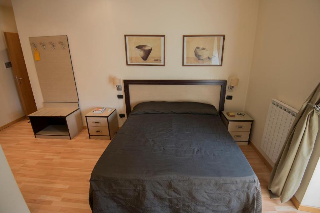 A bed or beds in a room at My Rooms