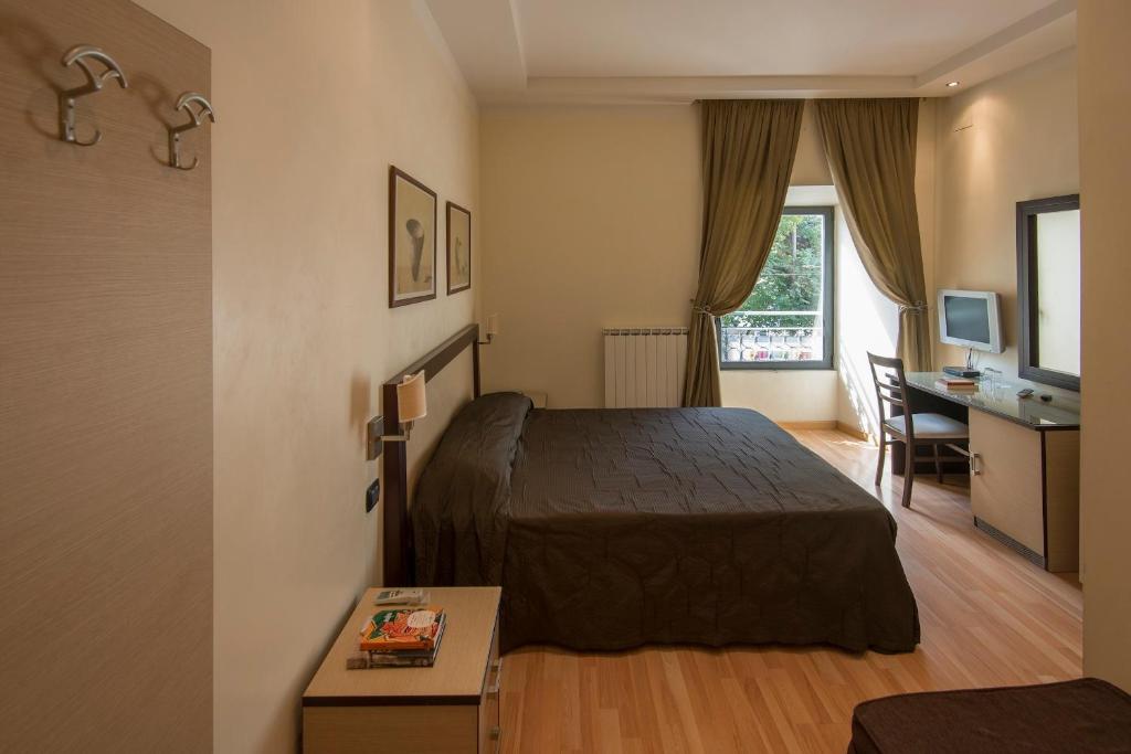 A bed or beds in a room at My Rooms