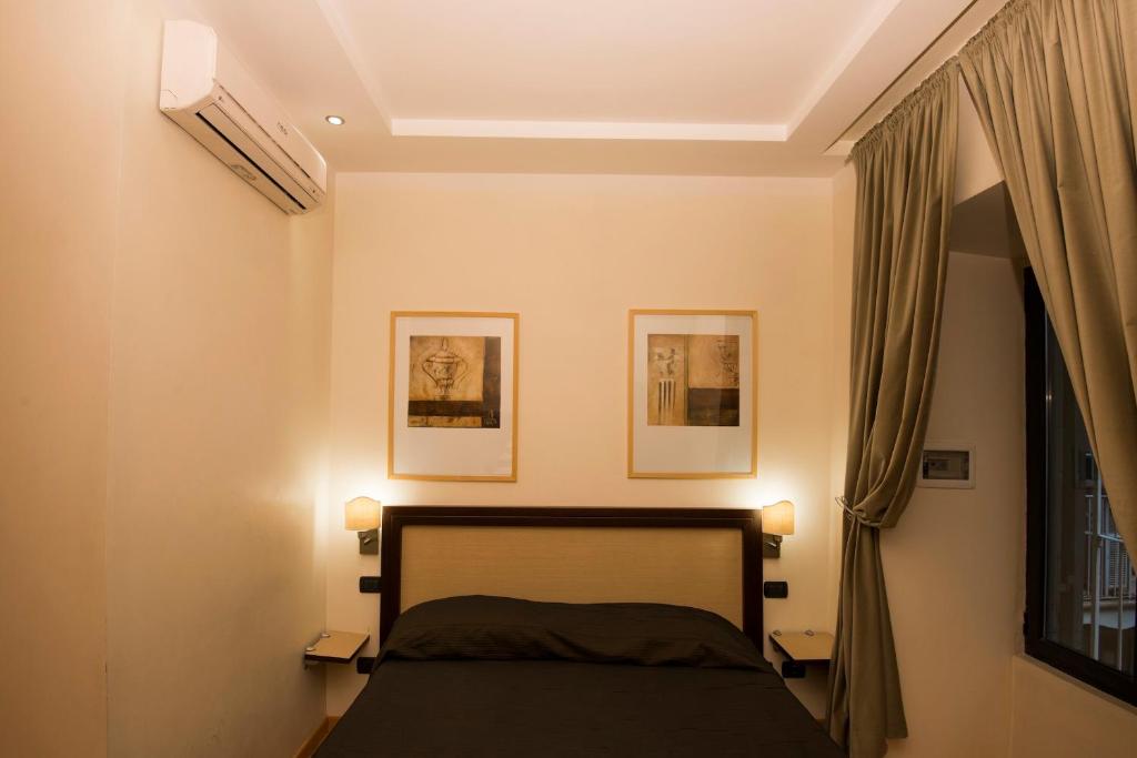 A bed or beds in a room at My Rooms
