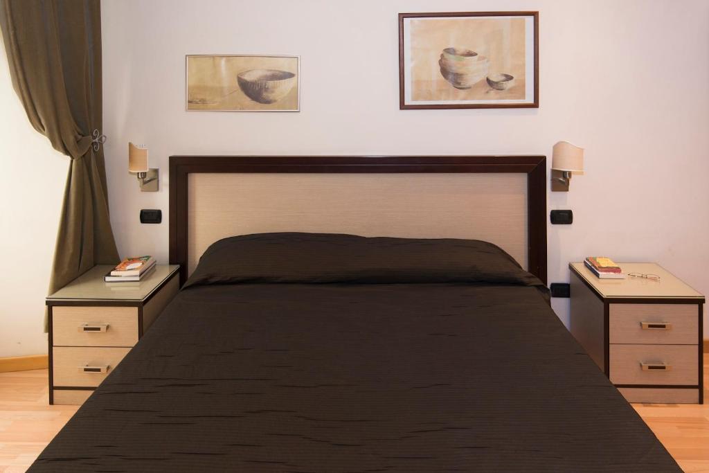 A bed or beds in a room at My Rooms