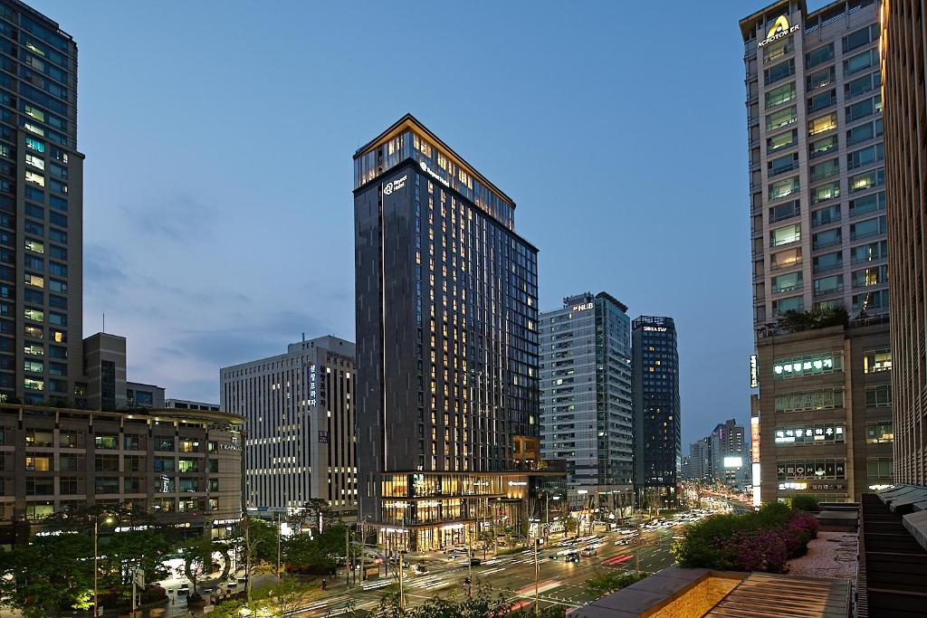 a city skyline with tall buildings and a street at Roynet Hotel Seoul Mapo in Seoul
