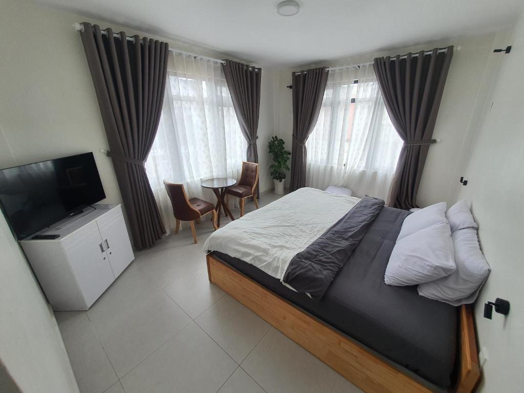 Postel nebo postele na pokoji v ubytování Hello Dalat Hostel