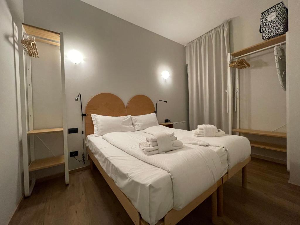 Łóżko lub łóżka w pokoju w obiekcie WelcomeVerona