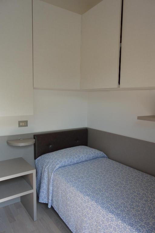 Postel nebo postele na pokoji v ubytování Hotel Paris