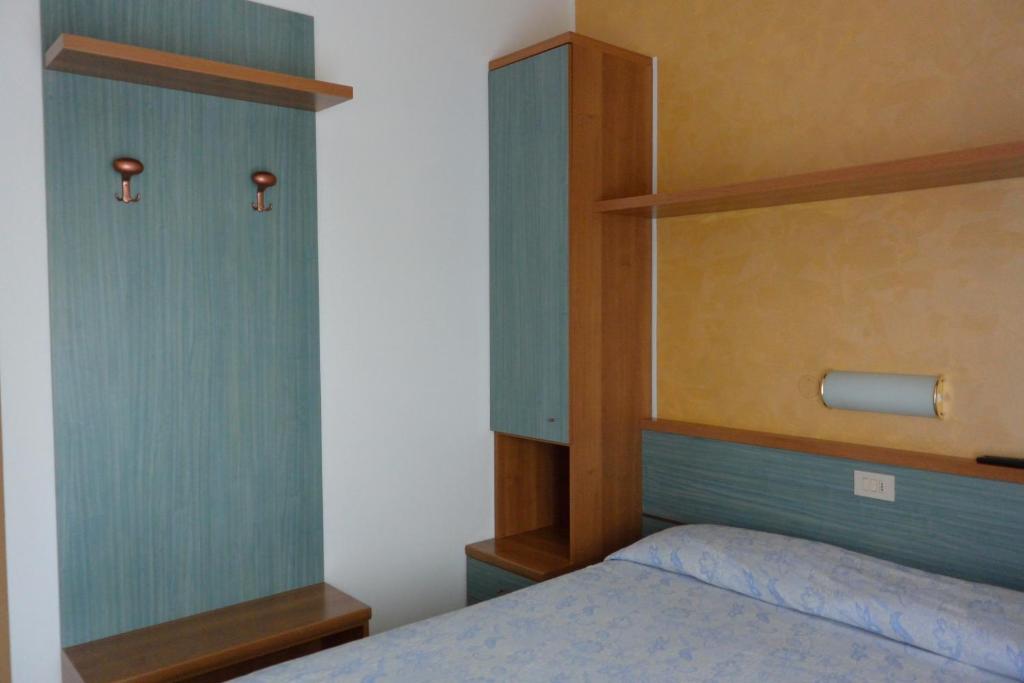 Postel nebo postele na pokoji v ubytování Hotel Paris