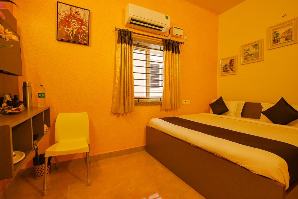 Postel nebo postele na pokoji v ubytování FabHotel Vijaylakshmi Stay Inn - Nr Chennai International Airport