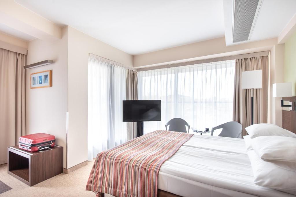 Postel nebo postele na pokoji v ubytování Hotel Arkon Park Gdańsk- Destigo Hotels