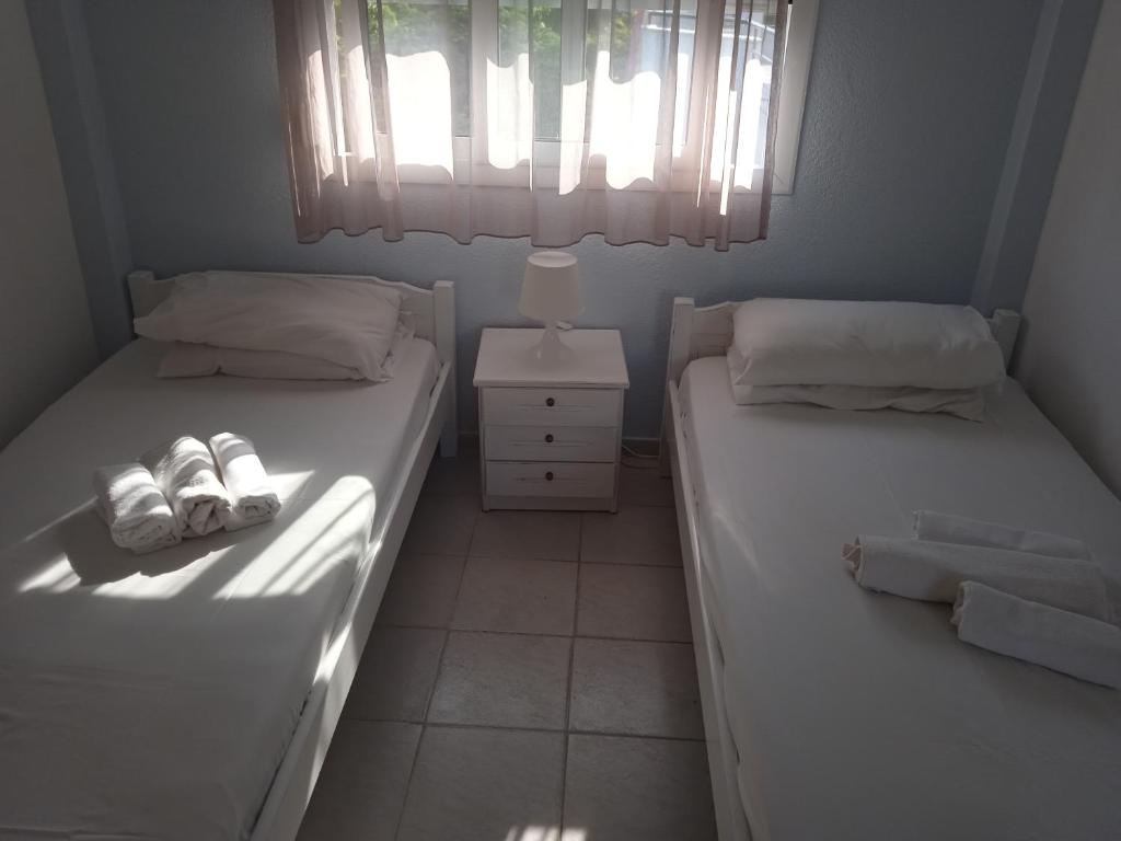 Postel nebo postele na pokoji v ubytování Antonia Rooms