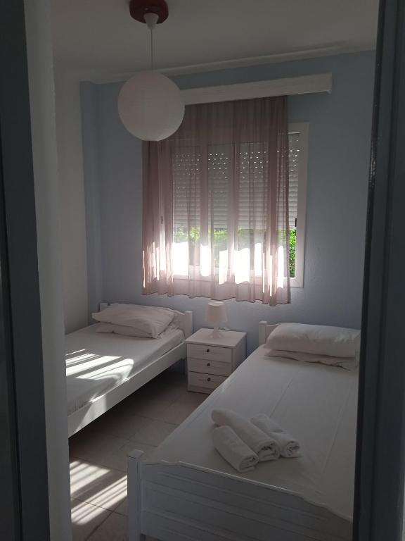 Postel nebo postele na pokoji v ubytování Antonia Rooms