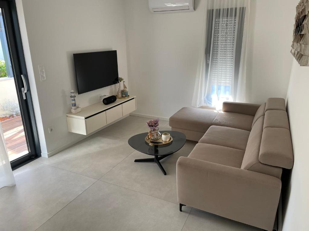TV a/nebo společenská místnost v ubytování Villa Magna luxury apartments