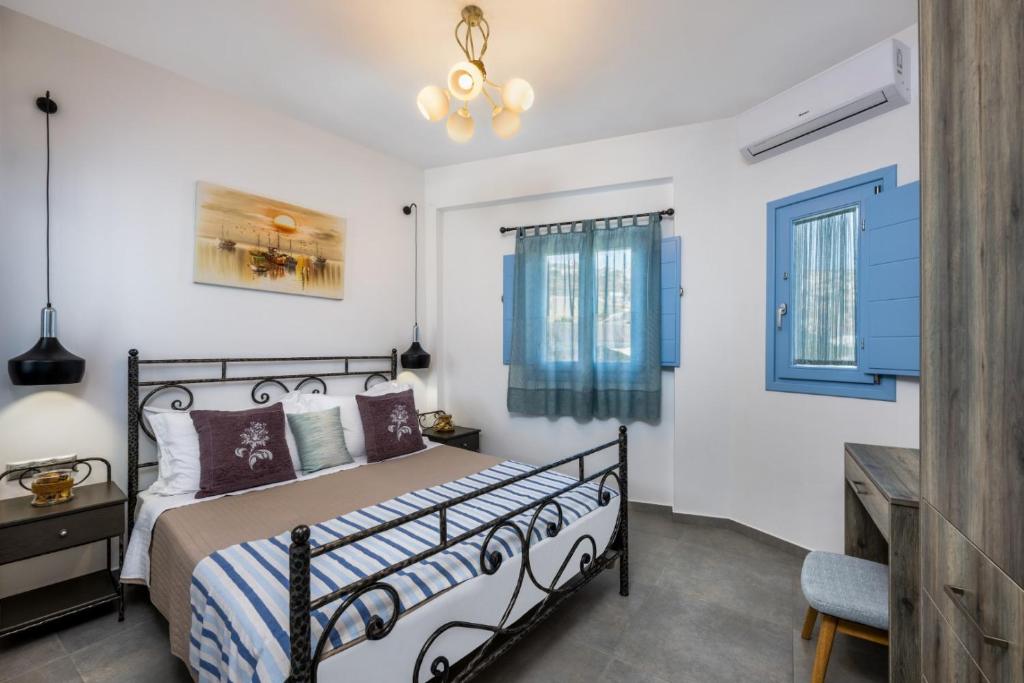 A bed or beds in a room at La Boheme Villas