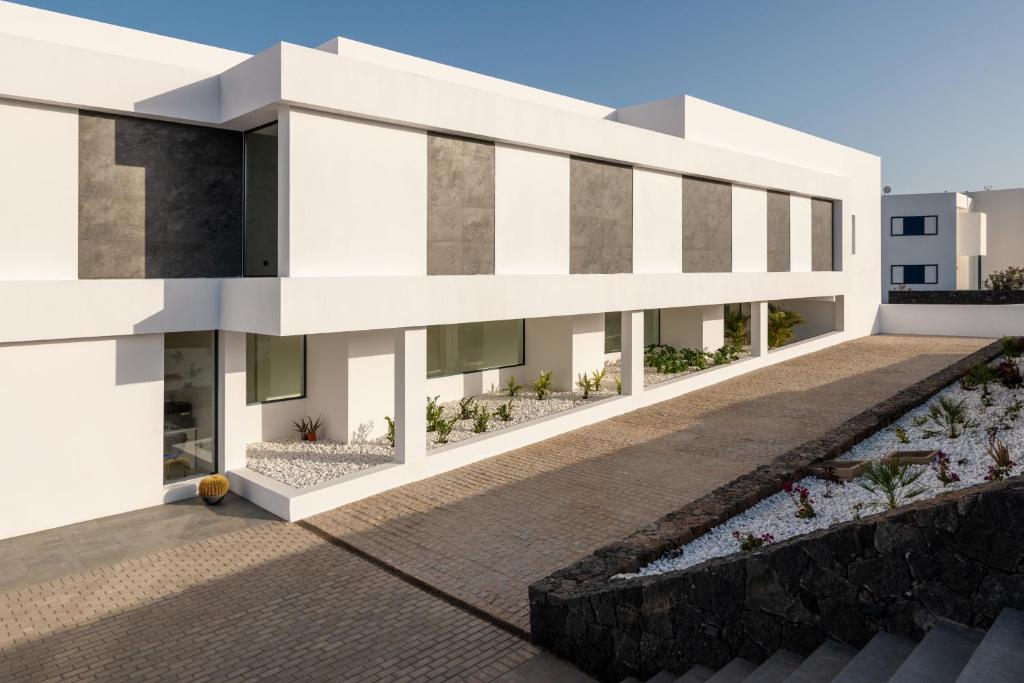 a rendering of a white building at Royal Marina Suites Boutique Hotel - Adults Only in Puerto Calero