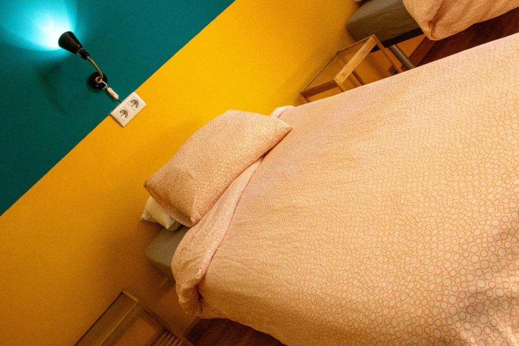 Postel nebo postele na pokoji v ubytování Onefam Sungate
