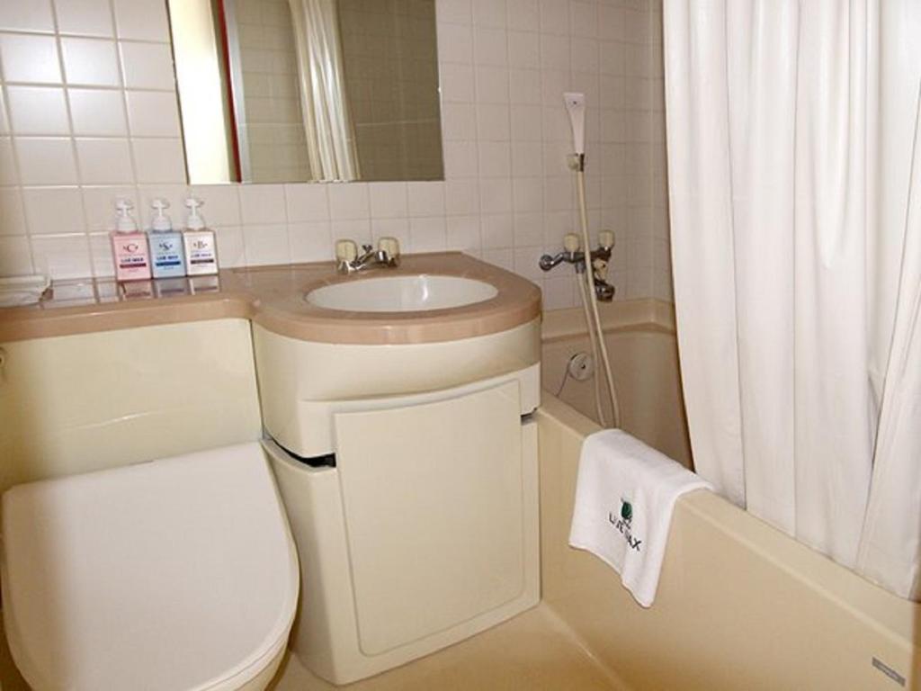 Koupelna v ubytování HOTEL LiVEMAX BUDGET Esaka