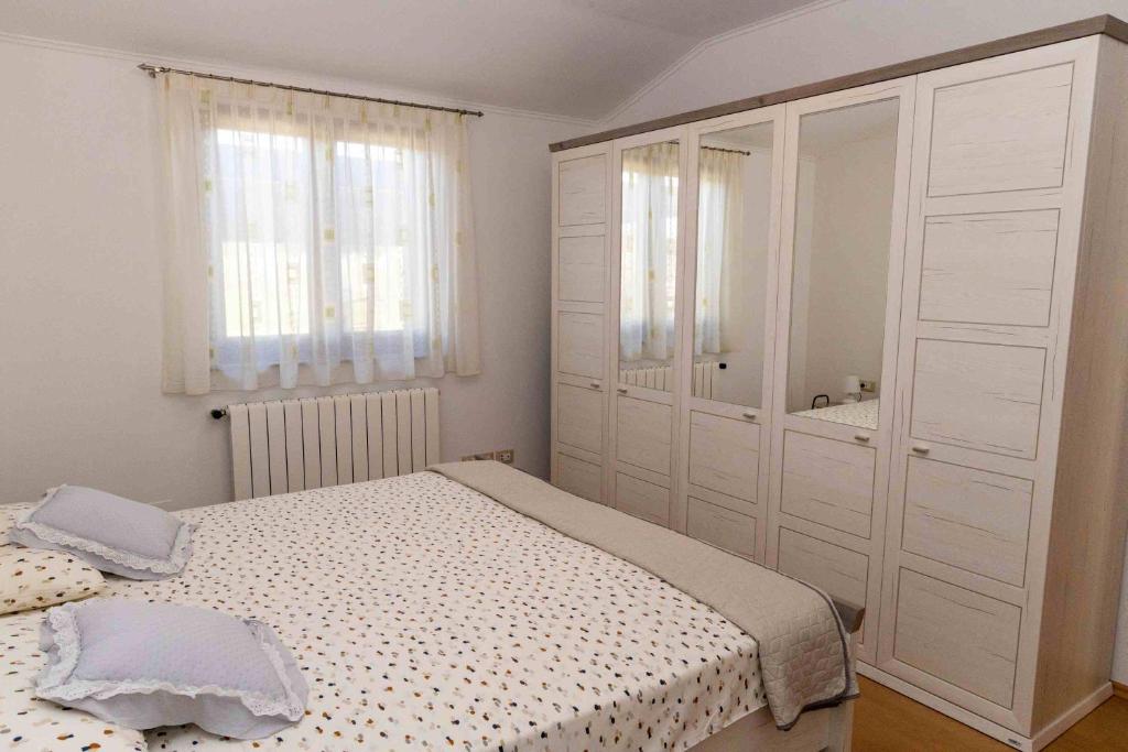 Posteľ alebo postele v izbe v ubytovaní COUNTRY HOUSE NINA