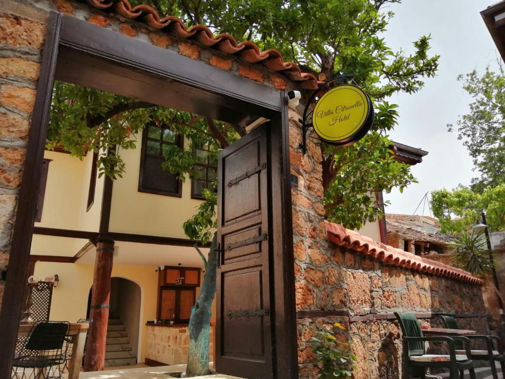 a door to a house with a sign on it at Villa Citronella Boutique Hotel in Antalya