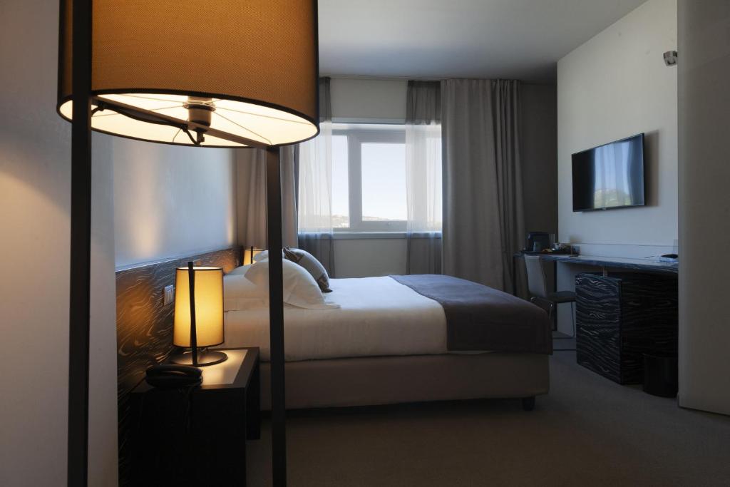 Postel nebo postele na pokoji v ubytování G Hotel Ancona