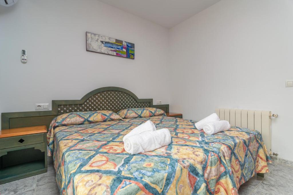 Postel nebo postele na pokoji v ubytování Casa Manolo