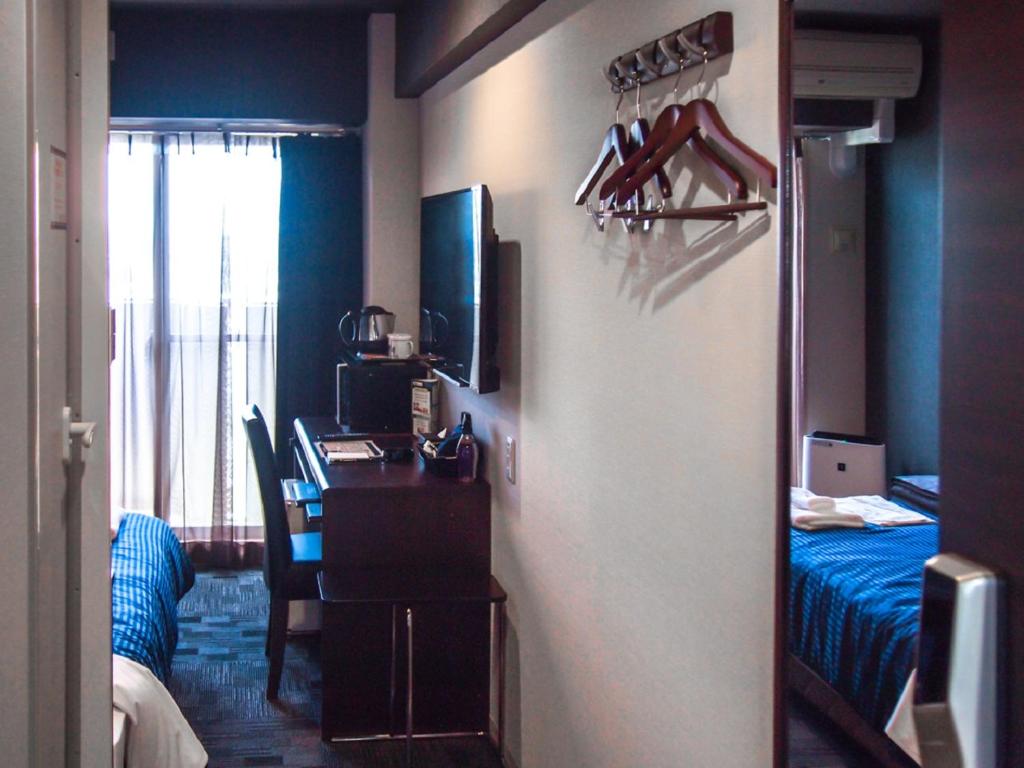 Katil atau katil-katil dalam bilik di HOTEL LiVEMAX BUDGET Nagoya Taikodori
