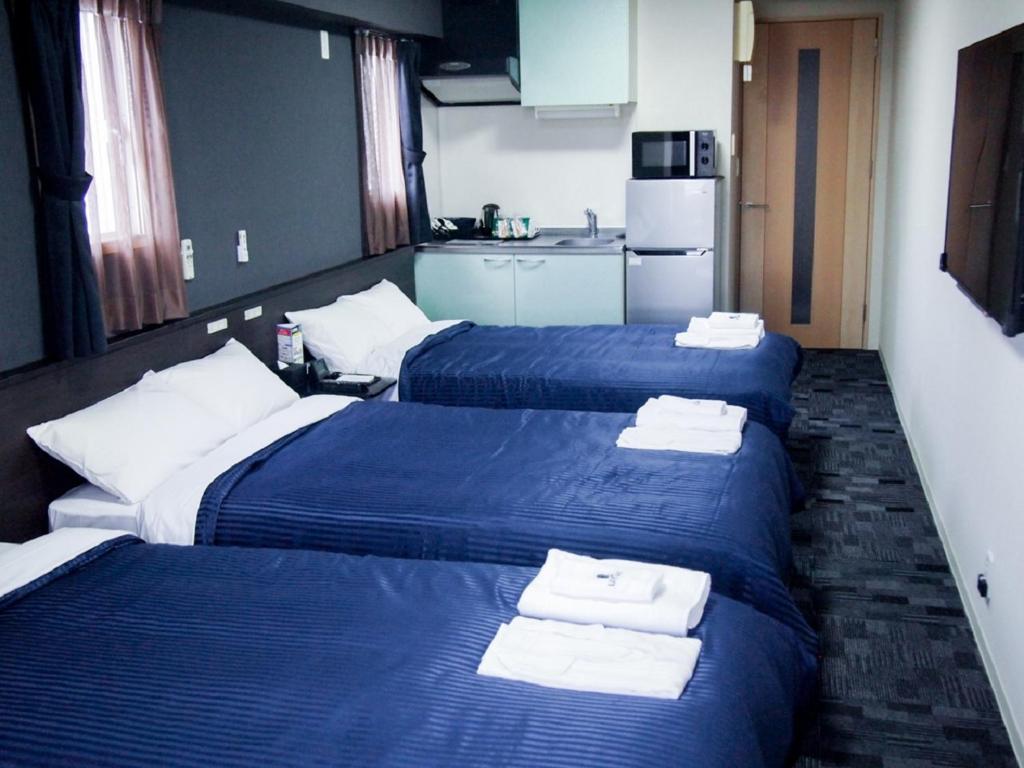 Katil atau katil-katil dalam bilik di HOTEL LiVEMAX BUDGET Nagoya Taikodori