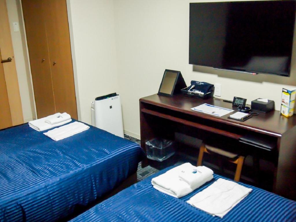 Katil atau katil-katil dalam bilik di HOTEL LiVEMAX BUDGET Nagoya Taikodori