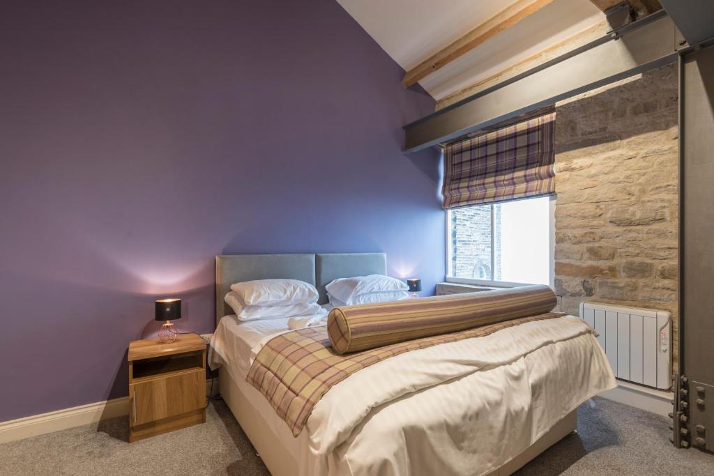 Postel nebo postele na pokoji v ubytování Heritage Serviced Suites - Serviced Apartments