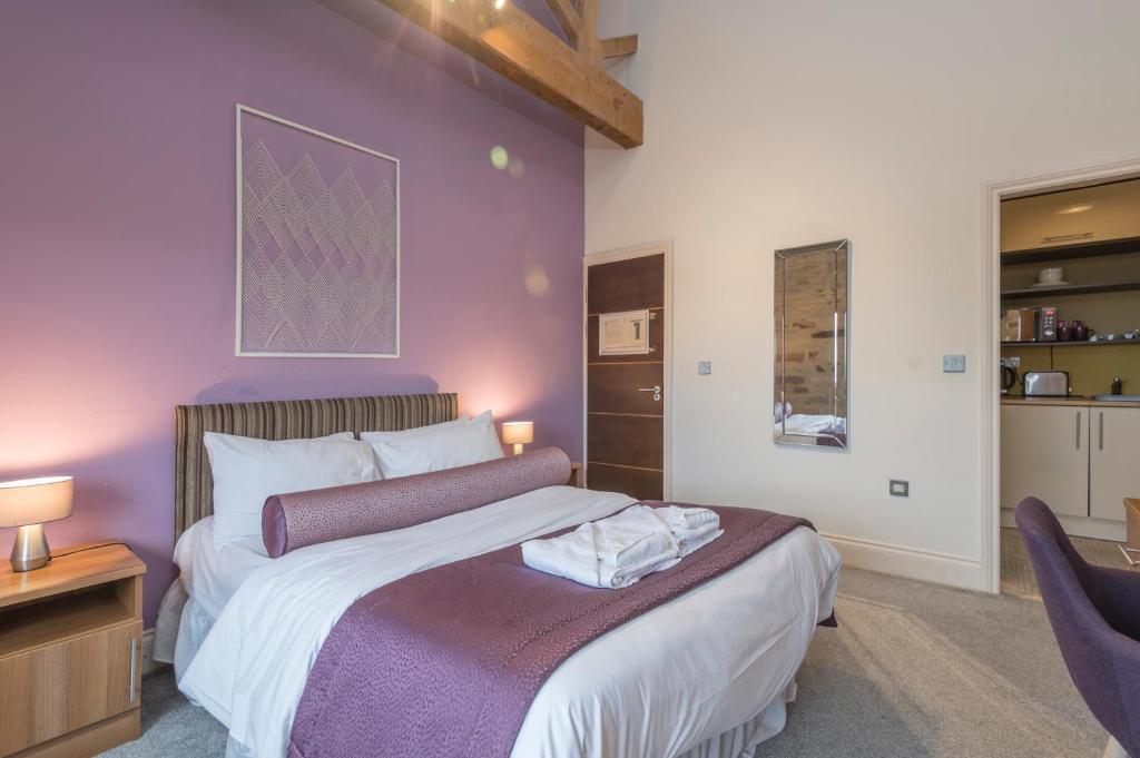 Postel nebo postele na pokoji v ubytování Heritage Serviced Suites - Serviced Apartments