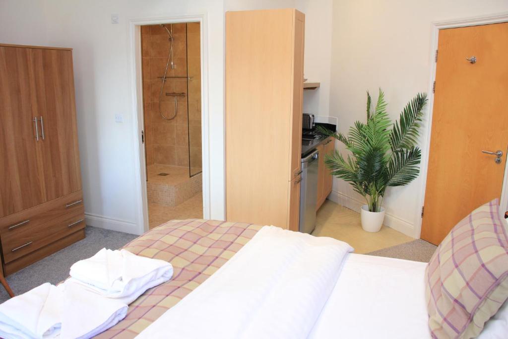Postel nebo postele na pokoji v ubytování Heritage Serviced Suites - Serviced Apartments