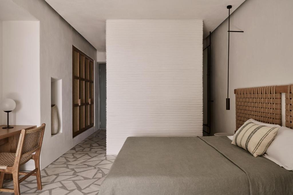 Tempat tidur dalam kamar di Archipelagos All Suites