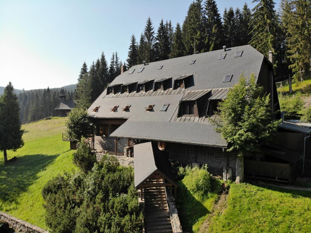 an aerial view of a house with a roof at Horský hotel Vidly in Karlova Studánka