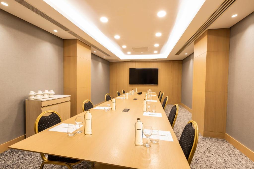 a conference room with a long table and chairs at Radisson Hotel Istanbul Harbiye in Istanbul