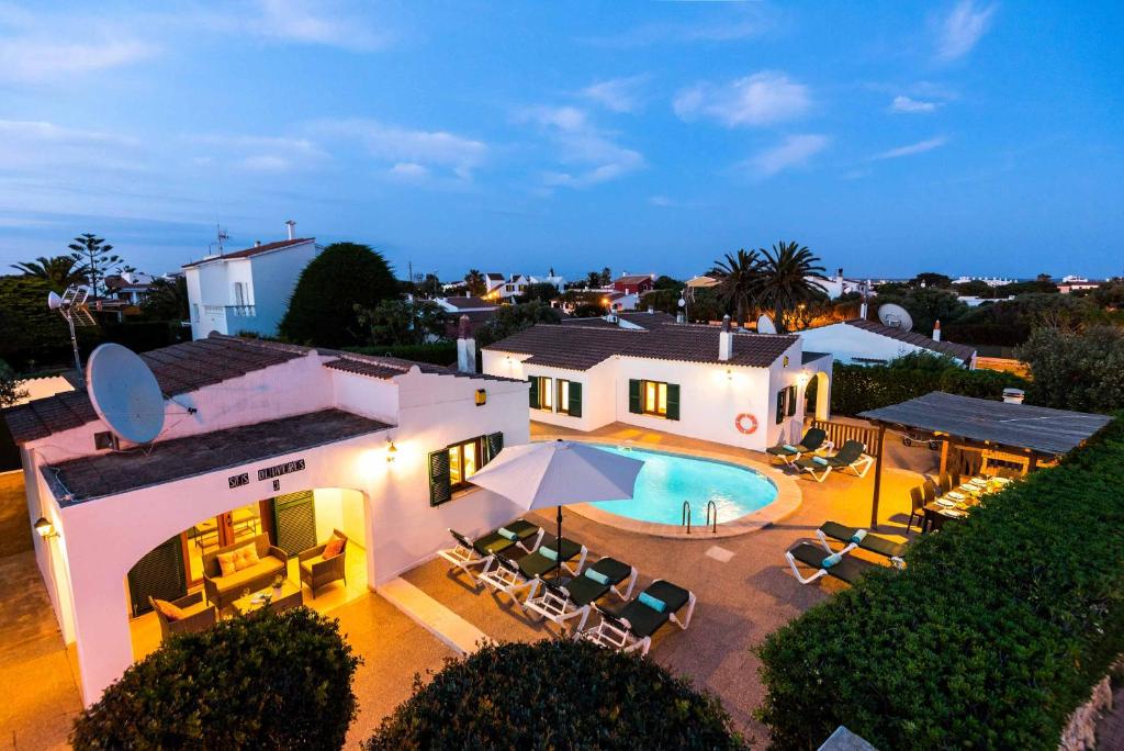 an aerial view of a house with a swimming pool at Villa Tramontana in Cala en Blanes