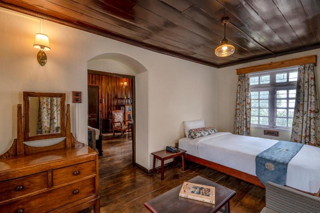 Postel nebo postele na pokoji v ubytování Sterling Park Kalimpong