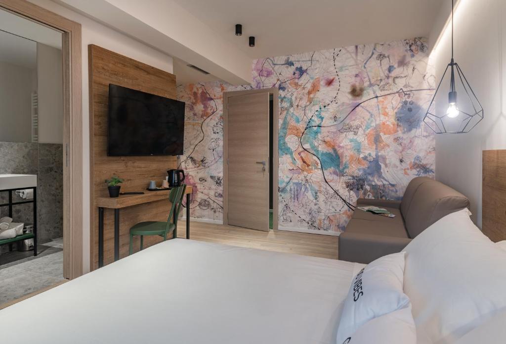 Postel nebo postele na pokoji v ubytování Catignano Hotel