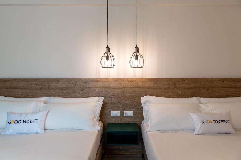 Postel nebo postele na pokoji v ubytování Catignano Hotel