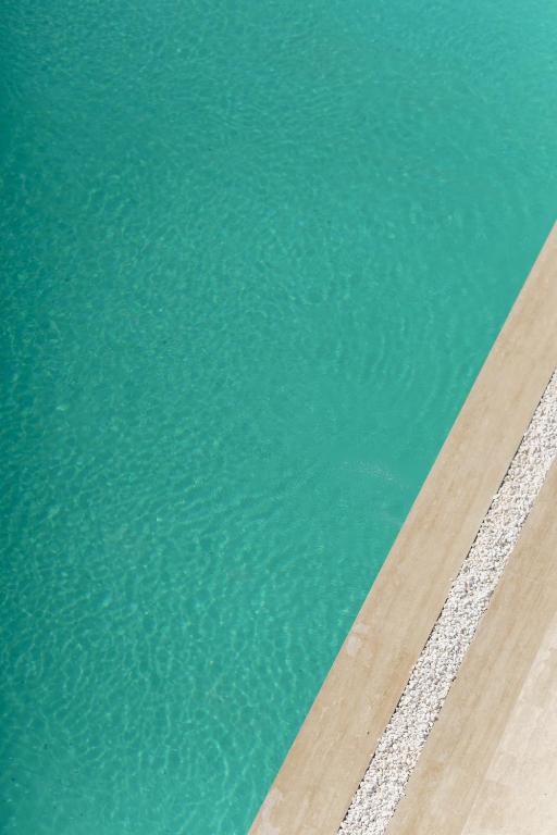an image of a swimming pool with water at Costa Maya Bodrum in Bodrum City