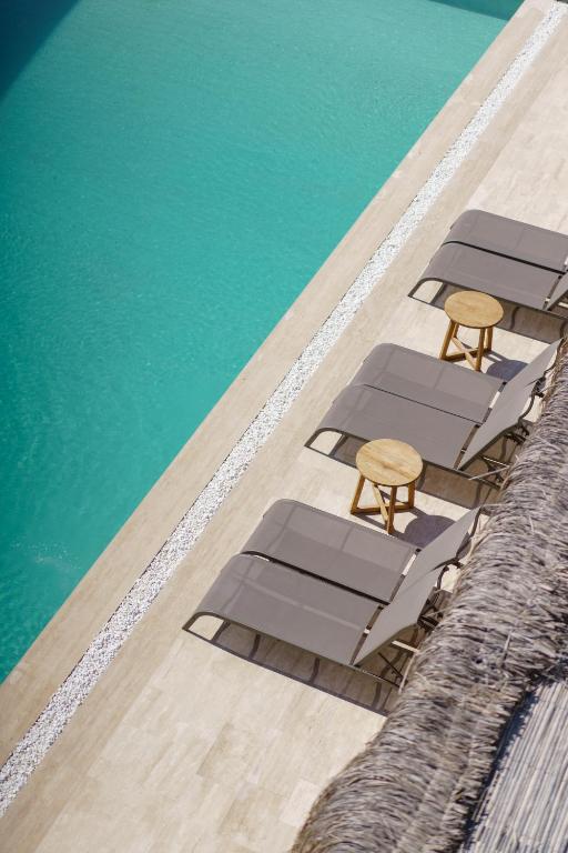 an overhead view of a pool with chairs and the water at Costa Maya Bodrum in Bodrum City