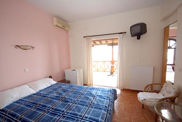 Postel nebo postele na pokoji v ubytování Porto Kalliali