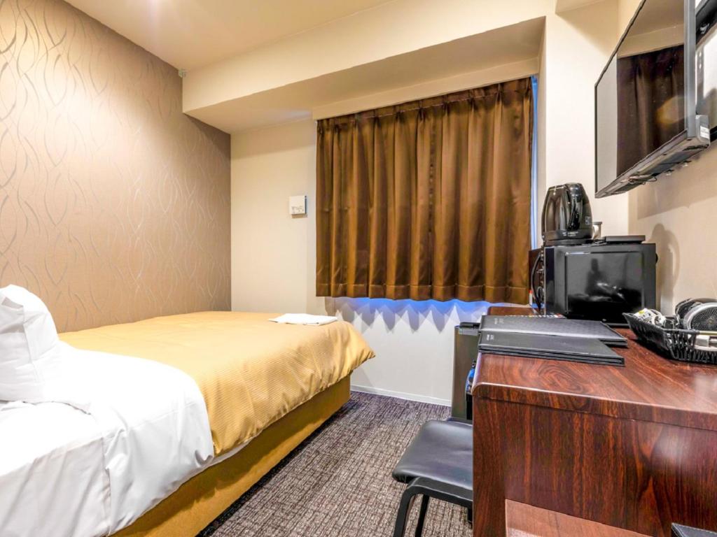 TV a/nebo společenská místnost v ubytování HOTEL LiVEMAX Okazaki